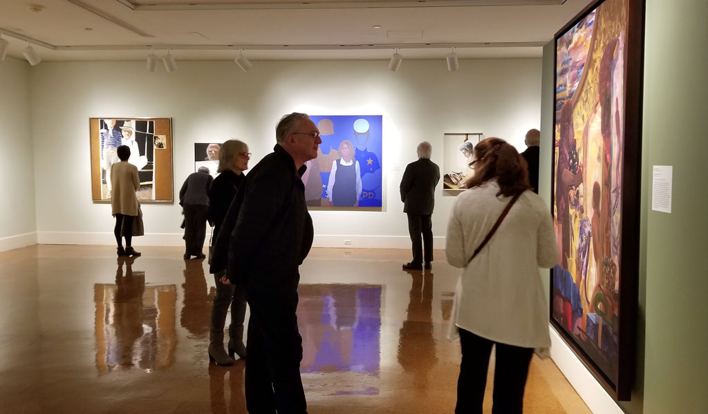 Visitors view James McGarrell's Bison Self-Portrait at the exhibition For America: Paintings from the National Academy of Design at Dayton Art Institute