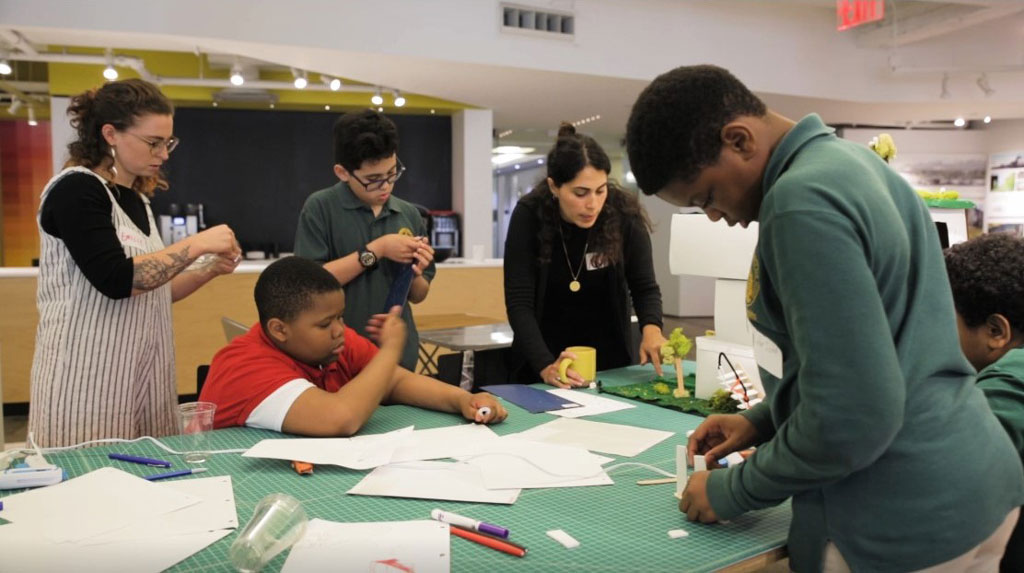 New York City students and Snohetta employees work together to build an architectural model