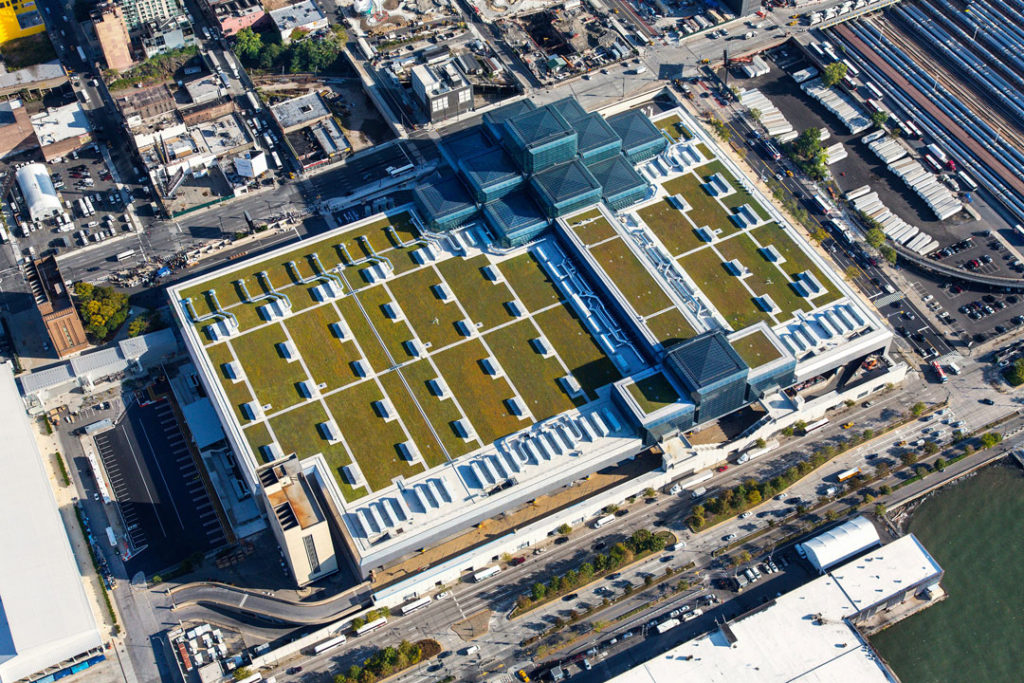An aerial shot of the Javits Center showing the building's large size that stretches over multiple city blocks. The green roof extends across the entire building.
