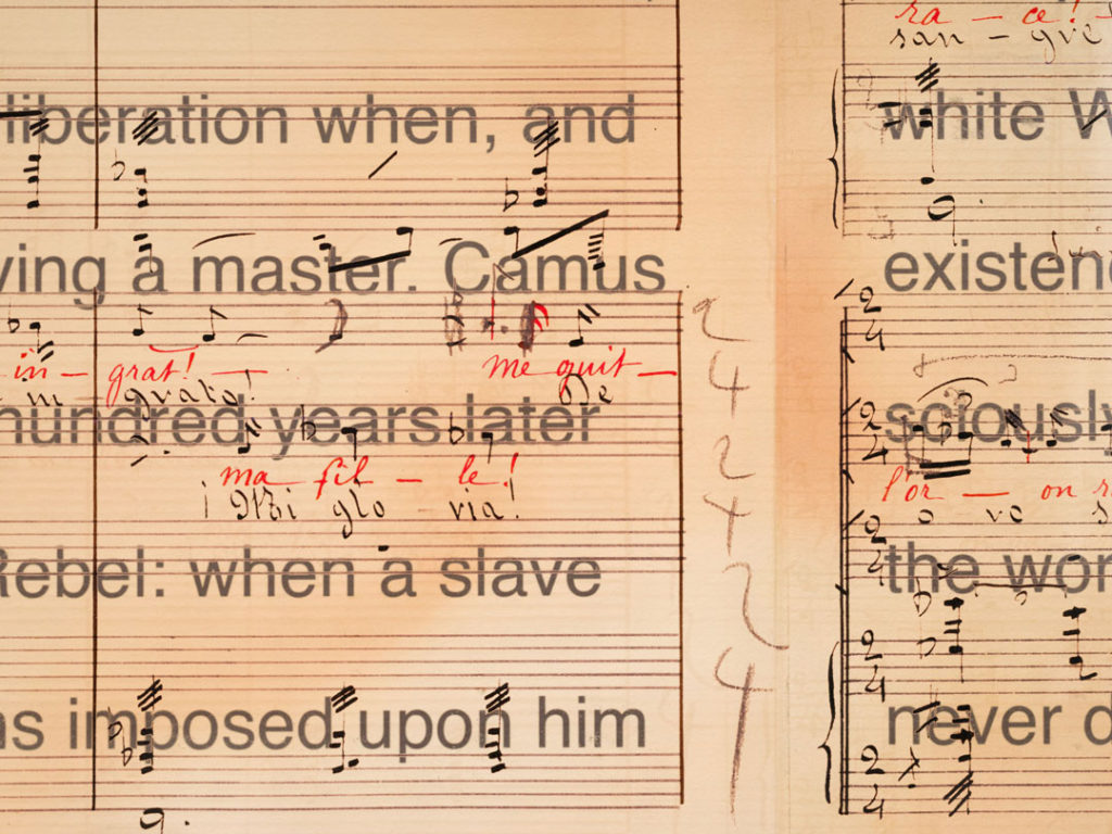 An detailed view of Librettos: Manuel de Falla/Stokely Carmichael by Charles Gaines.  We see a few bars of music, handwritten annotations, and lyrics.  On the left are visible the lyrics: “liberation when, and” / “a master. Camus” / “hundred years later” / “Rebel: when a slave” / “imposed upon him.” 