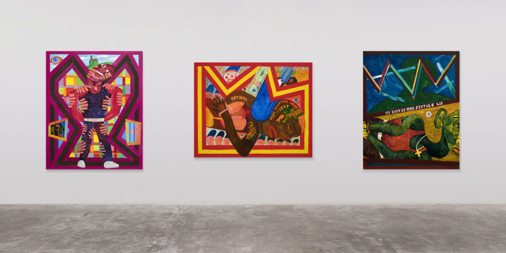 A photograph of the installation view of The George Floyd Triptych.  We see three paintings made up of different colors and scenes in the life of a Black man.