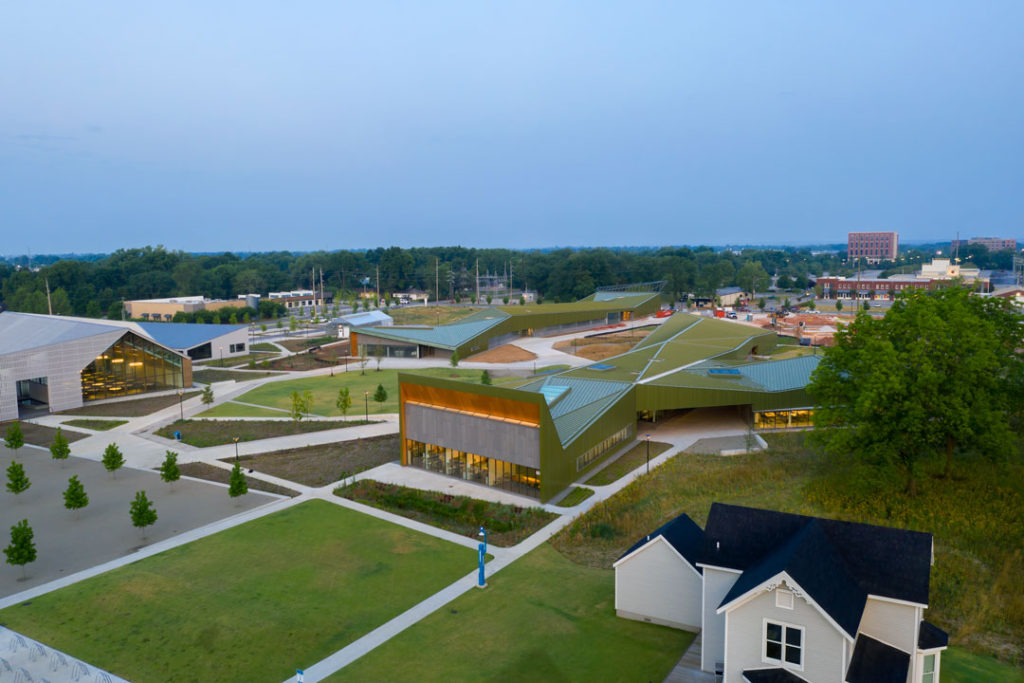 A long view of The Reels building at Thaden School which shows its central location on the expansive outdoor campus.