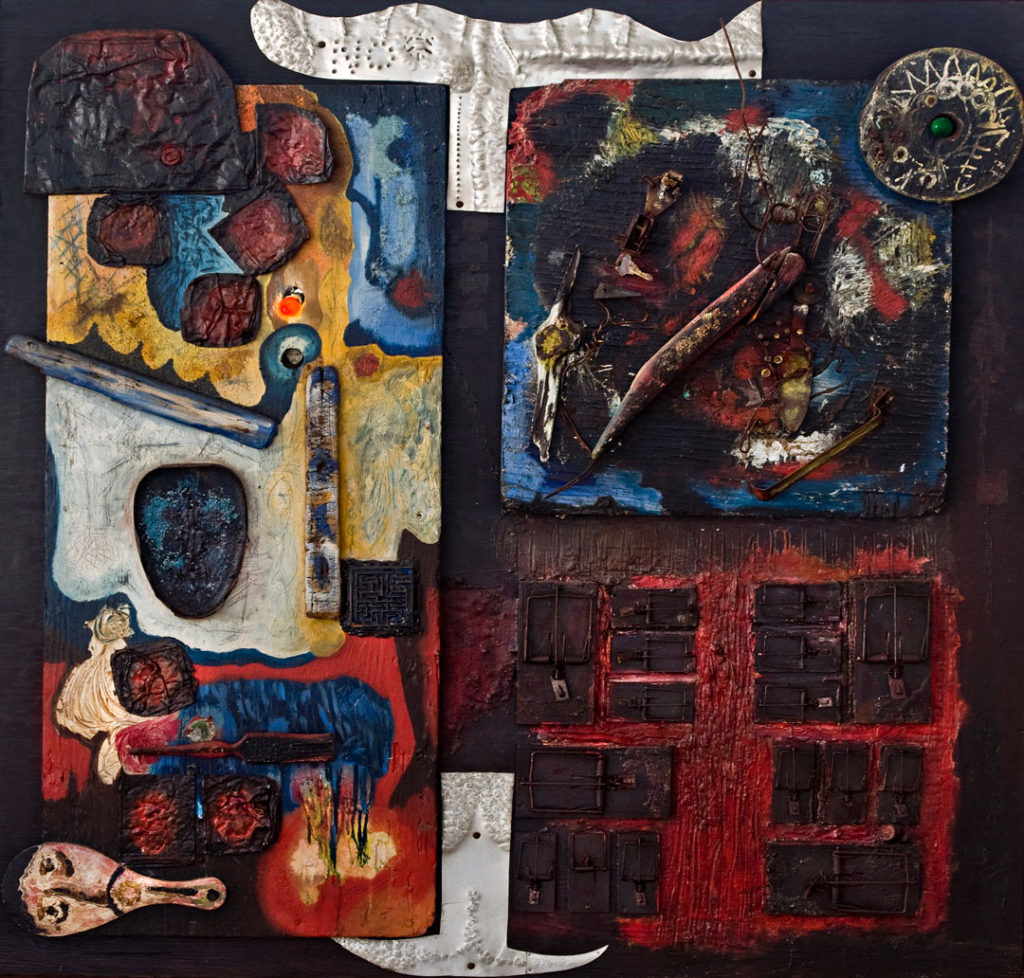 A photograph of a mixed media painting constructed from different scrap materials, including wood, pressed tin, mouse traps, and light bulbs.